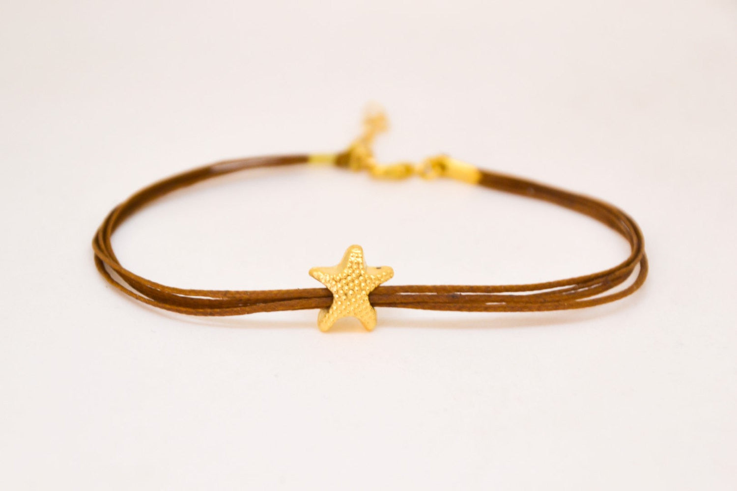 Ankle bracelet with gold plated starfish charm, brown string - shani-adi-jewerly