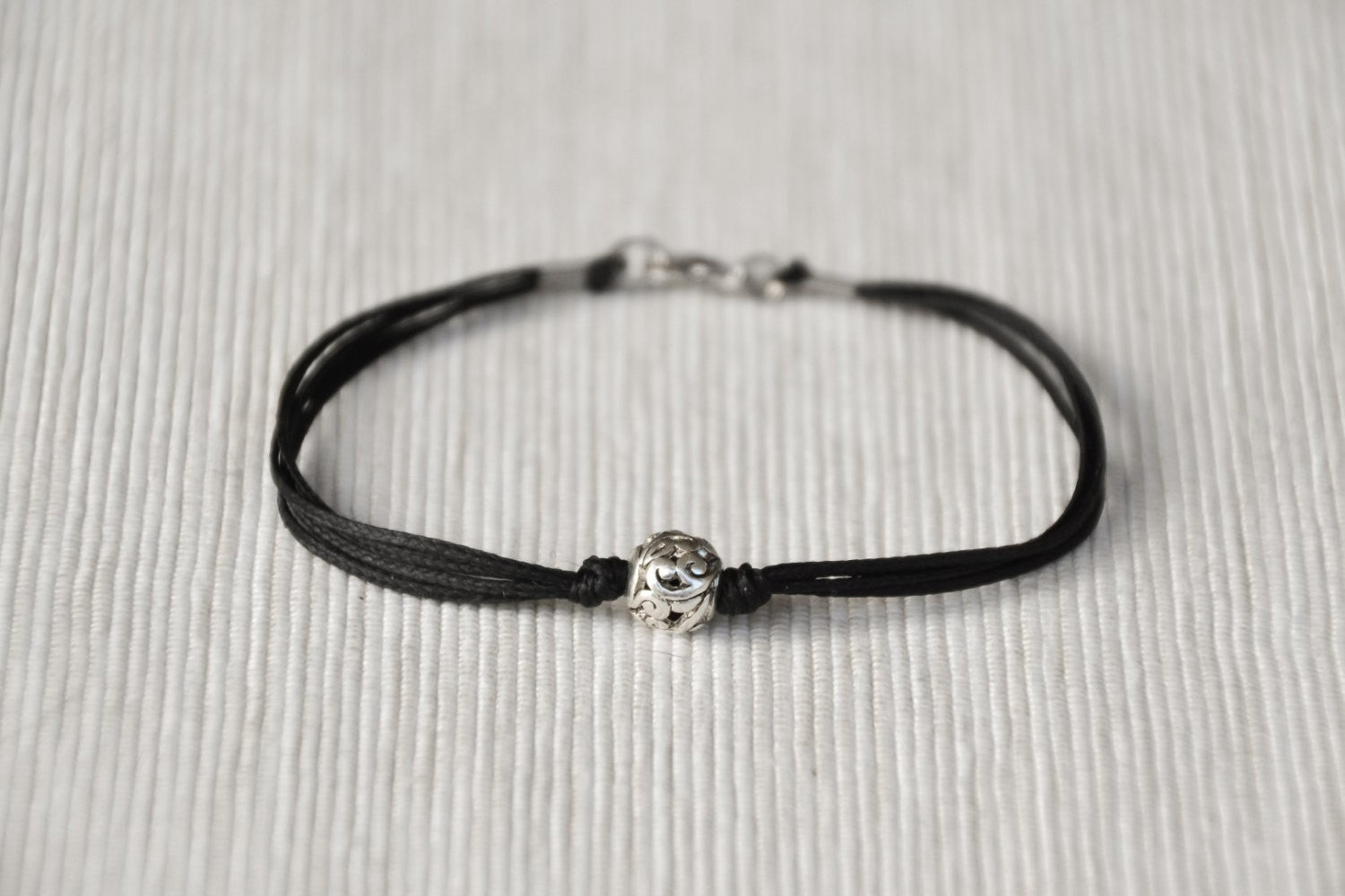 Men's bracelet with silver bead charm and a black cord - shani-adi-jewerly