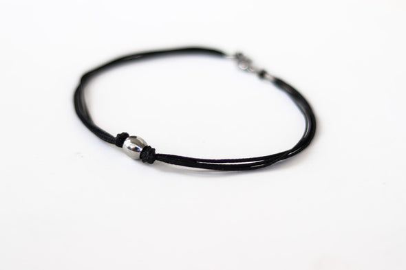 Men's anklet with a stainless steel waterproof bead and a black cord