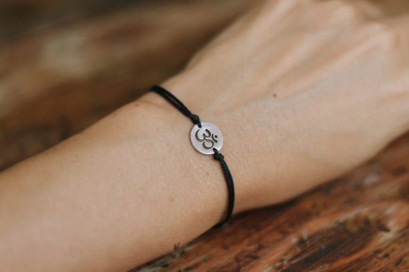 handmade silver om bracelet for women, black cord - shani and adi jewelry