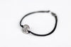 handmade silver om bracelet for women, black cord - shani and adi jewelry