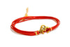 Wrapped red bracelet with gold tone Om charm - shani-adi-jewerly
